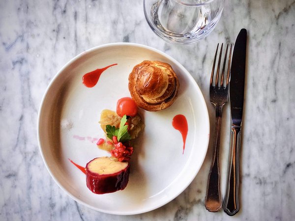 What local dishes should you try when visiting Liverpool?
