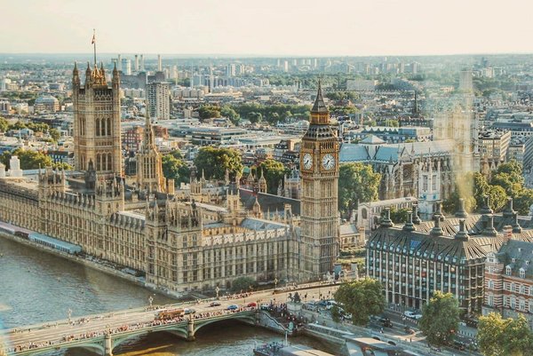 How do UK cities adapt tourism services for non-English speakers?